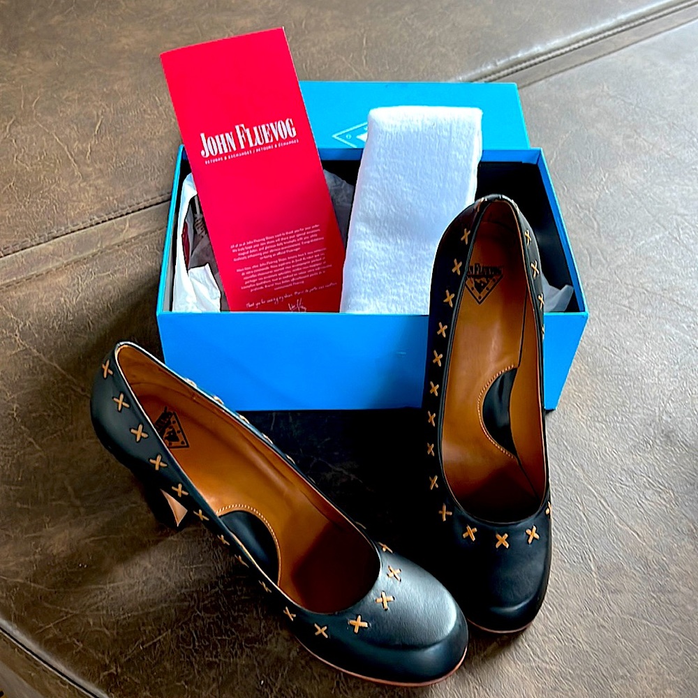 Women’s slip on pumps, size 11, genuine leather with protective storage bag.